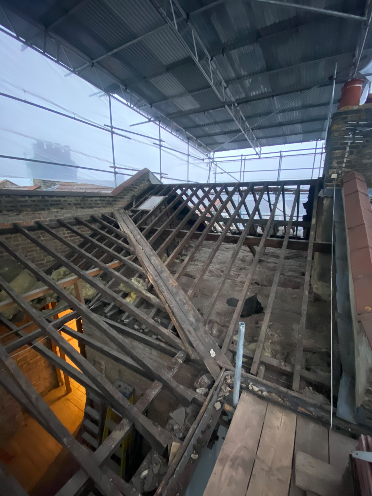 Existing roof stripped back for structural work