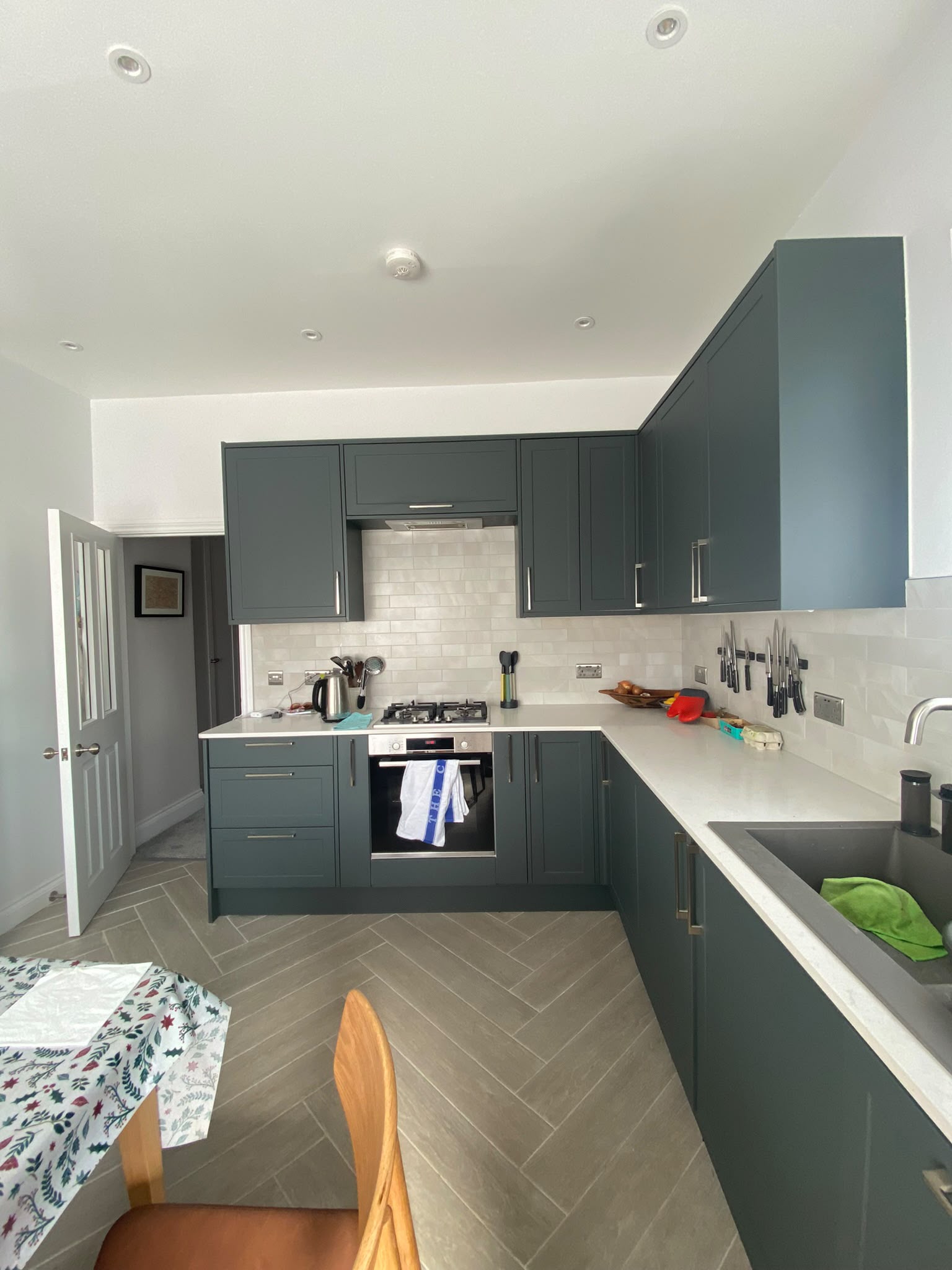 Finished fitted kitchen with herringbone floor
