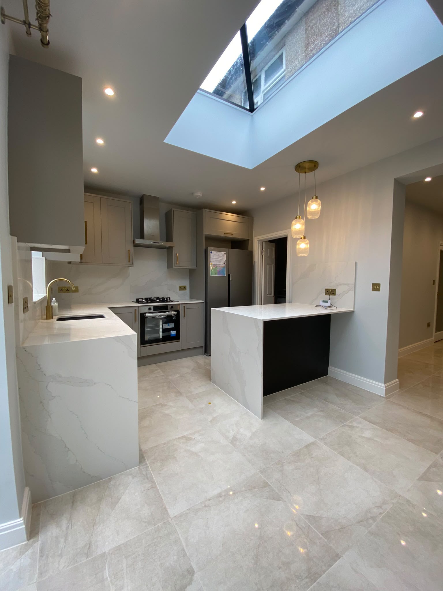 Completed fitted kitchen beneath rooflight