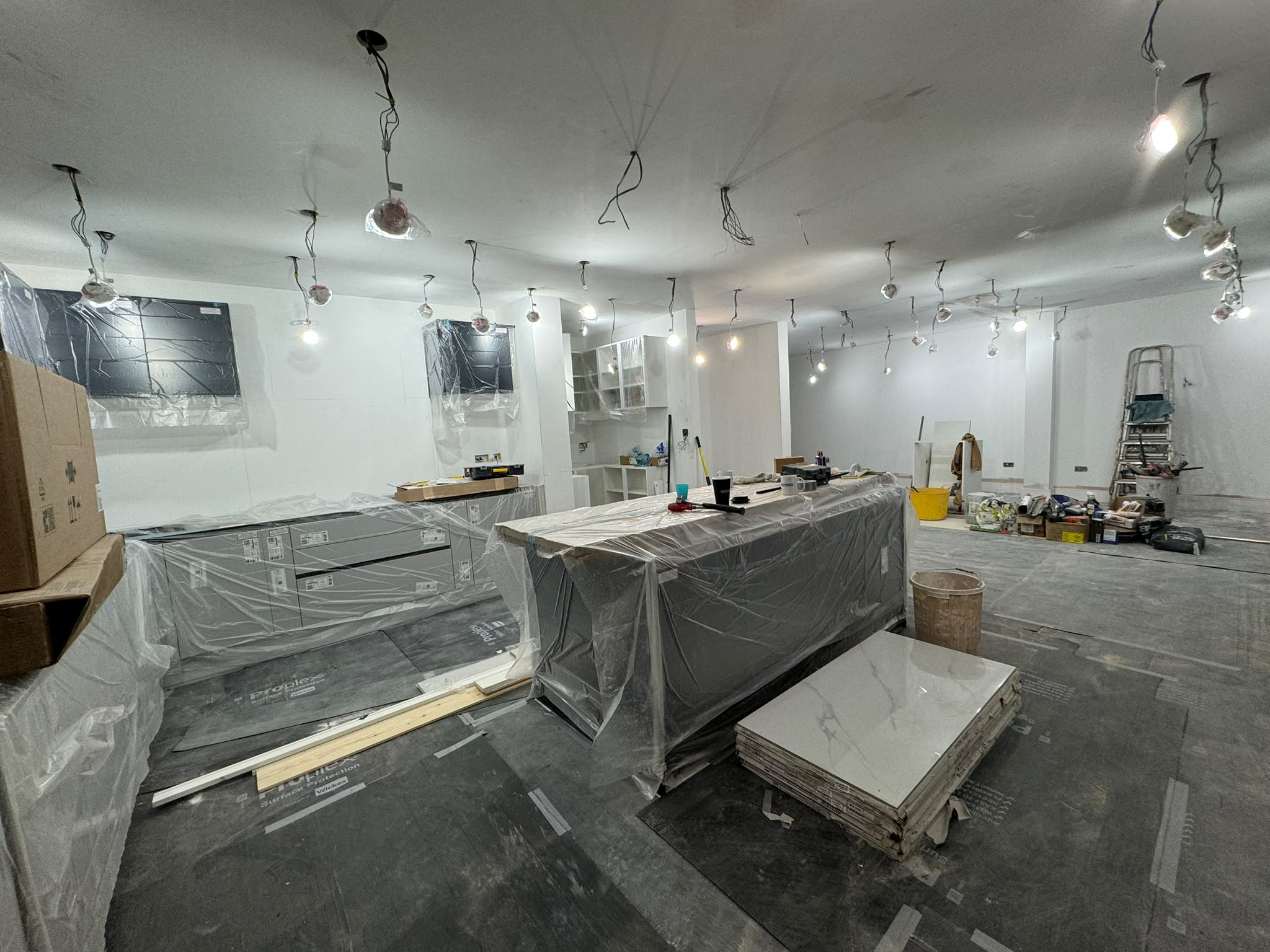 Open-plan kitchen during installation