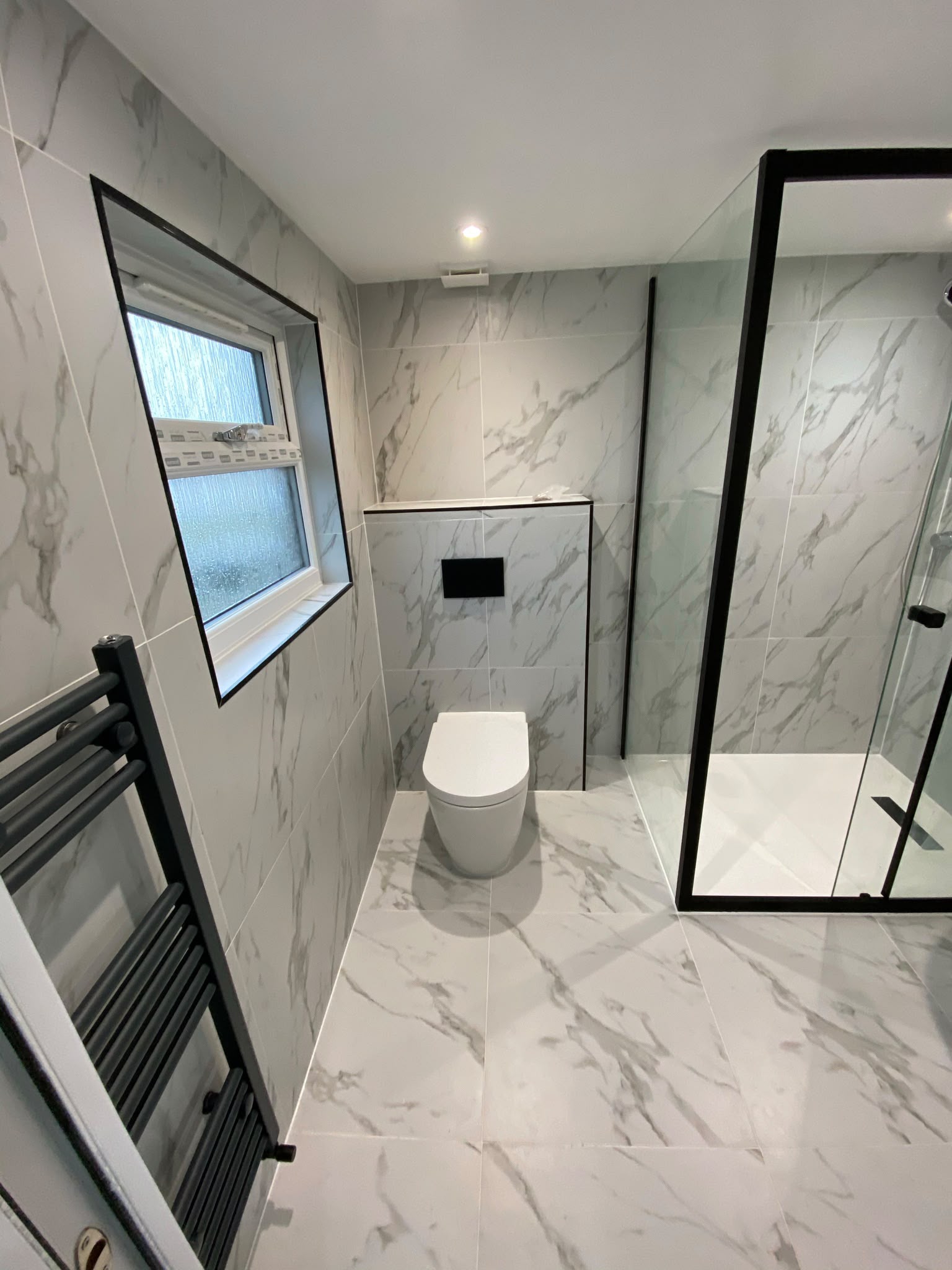 Completed marble-effect bathroom renovation